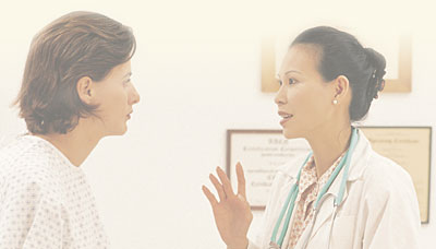 Physician consulting a patient.