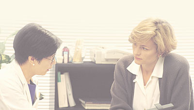 Physician consulting a patient.